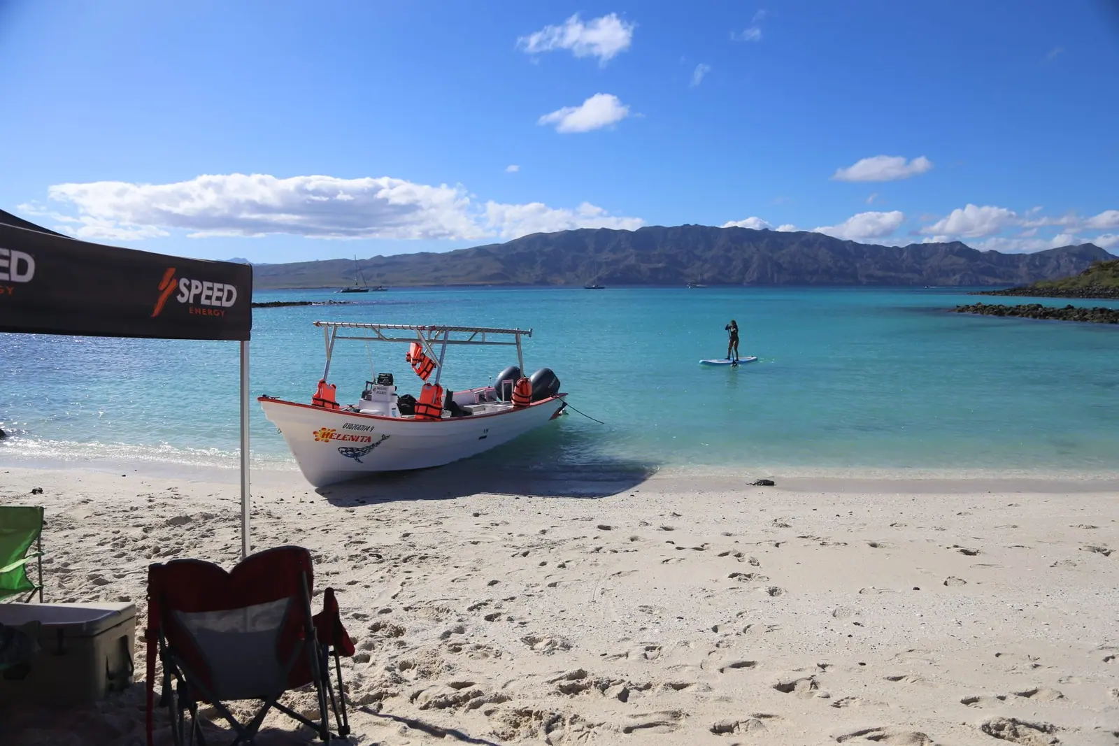 boat at the beach,shade and chair during a blue whale watching tour in Loreto